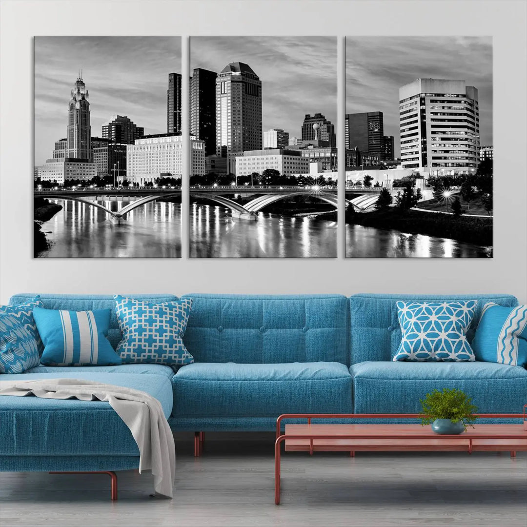 Columbus City Lights Skyline Black and White Wall Art Cityscape Canvas Print, featuring a city skyline over a river, is elegantly displayed.