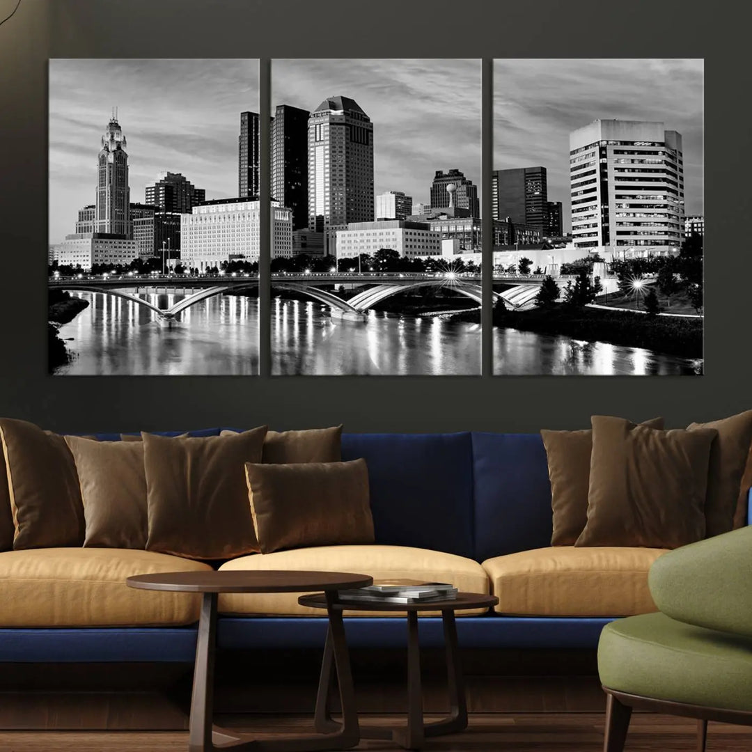 Columbus City Lights Skyline Black and White Wall Art Cityscape Canvas Print, featuring a city skyline over a river, is elegantly displayed.