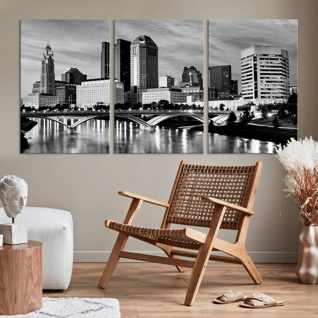 Columbus City Lights Skyline Black and White Wall Art Cityscape Canvas Print, featuring a city skyline over a river, is elegantly displayed.