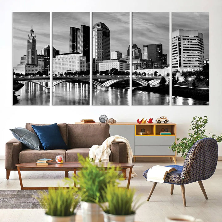 Columbus City Lights Skyline Black and White Wall Art Cityscape Canvas Print, featuring a city skyline over a river, is elegantly displayed.