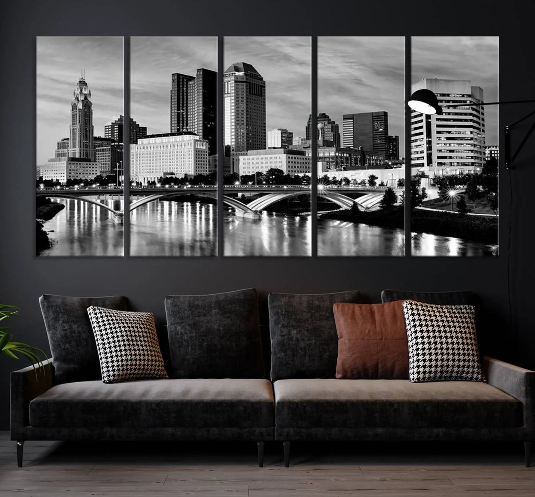 Columbus City Lights Skyline Black and White Wall Art Cityscape Canvas Print, featuring a city skyline over a river, is elegantly displayed.