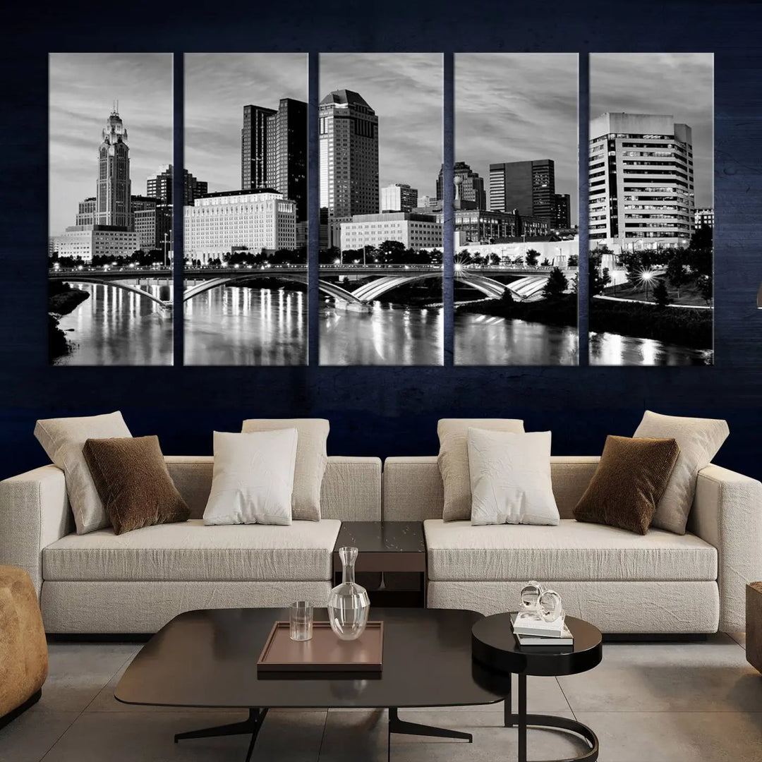 Columbus City Lights Skyline Black and White Wall Art Cityscape Canvas Print, featuring a city skyline over a river, is elegantly displayed.