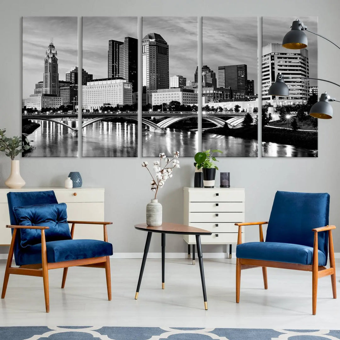 Columbus City Lights Skyline Black and White Wall Art Cityscape Canvas Print, featuring a city skyline over a river, is elegantly displayed.