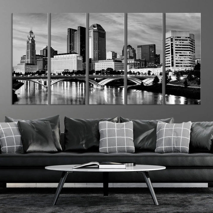 Columbus City Lights Skyline Black and White Wall Art Cityscape Canvas Print, featuring a city skyline over a river, is elegantly displayed.