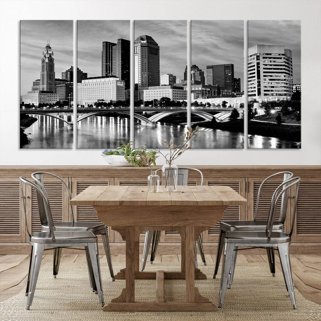 Columbus City Lights Skyline Black and White Wall Art Cityscape Canvas Print, featuring a city skyline over a river, is elegantly displayed.