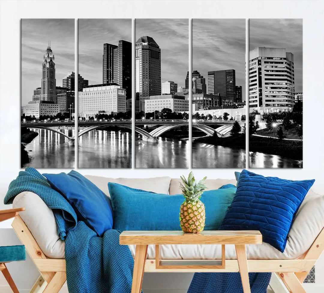 Columbus City Lights Skyline Black and White Wall Art Cityscape Canvas Print, featuring a city skyline over a river, is elegantly displayed.