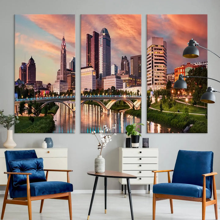 The "Columbus City Lights Sunset Orange Cloudy Skyline Cityscape View Wall Art Canvas Print" showcases a vibrant city skyline at sunset with a bridge spanning a river, strikingly displayed on museum-quality canvas.