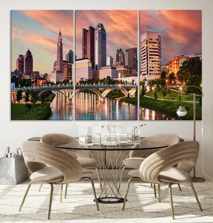 The "Columbus City Lights Sunset Orange Cloudy Skyline Cityscape View Wall Art Canvas Print" showcases a vibrant city skyline at sunset with a bridge spanning a river, strikingly displayed on museum-quality canvas.