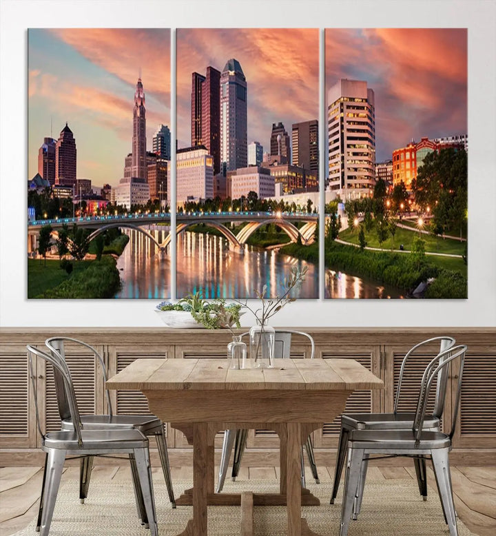 The "Columbus City Lights Sunset Orange Cloudy Skyline Cityscape View Wall Art Canvas Print" showcases a vibrant city skyline at sunset with a bridge spanning a river, strikingly displayed on museum-quality canvas.