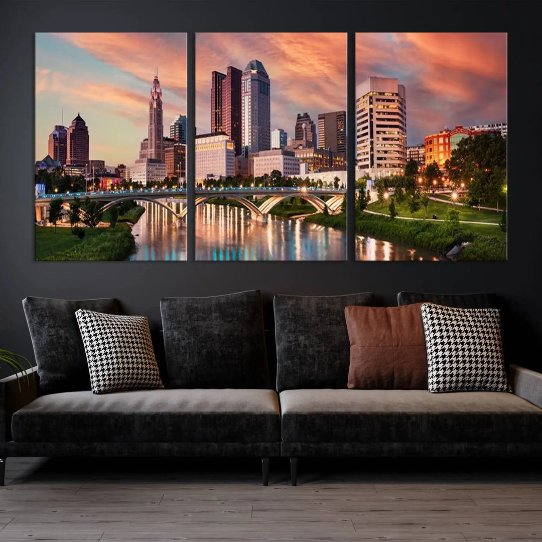 The "Columbus City Lights Sunset Orange Cloudy Skyline Cityscape View Wall Art Canvas Print" showcases a vibrant city skyline at sunset with a bridge spanning a river, strikingly displayed on museum-quality canvas.