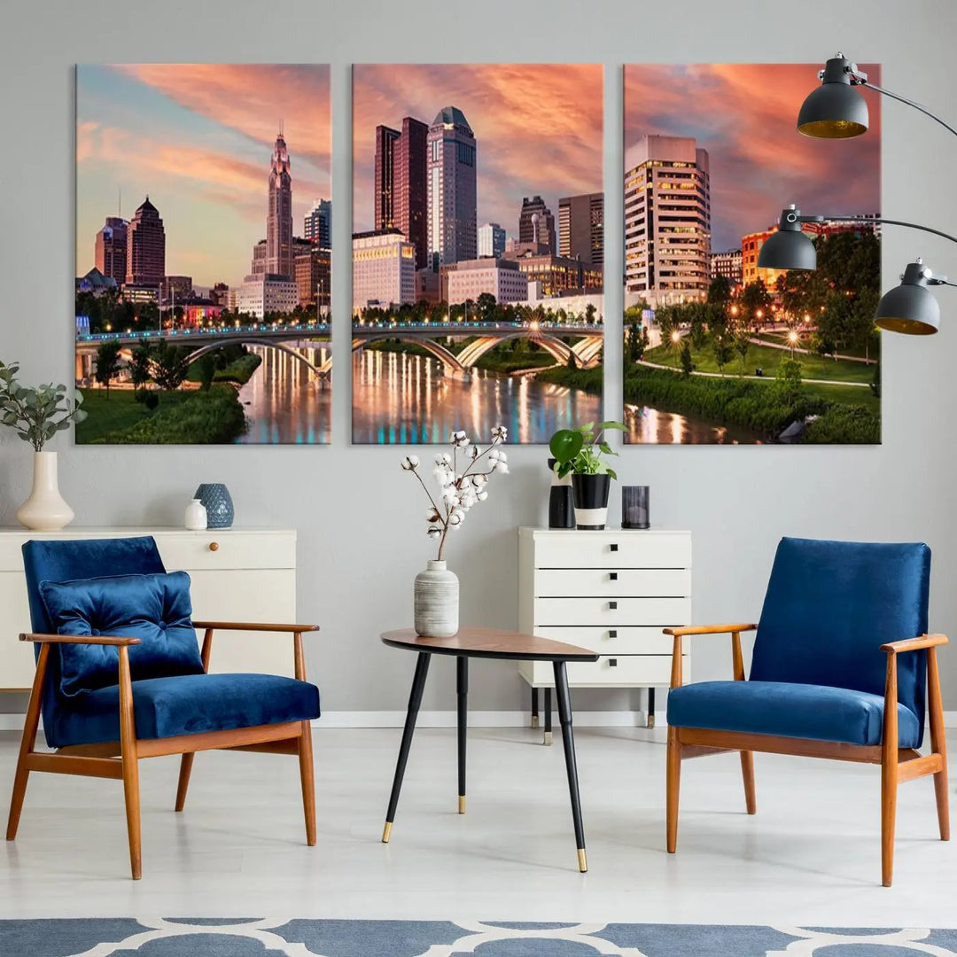 The "Columbus City Lights Sunset Orange Cloudy Skyline Cityscape View Wall Art Canvas Print" showcases a vibrant city skyline at sunset with a bridge spanning a river, strikingly displayed on museum-quality canvas.