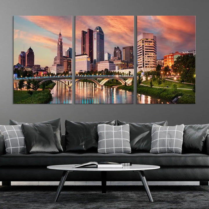 The "Columbus City Lights Sunset Orange Cloudy Skyline Cityscape View Wall Art Canvas Print" showcases a vibrant city skyline at sunset with a bridge spanning a river, strikingly displayed on museum-quality canvas.