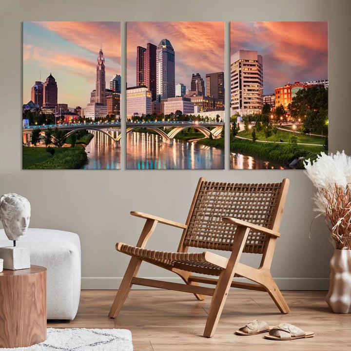 The "Columbus City Lights Sunset Orange Cloudy Skyline Cityscape View Wall Art Canvas Print" showcases a vibrant city skyline at sunset with a bridge spanning a river, strikingly displayed on museum-quality canvas.