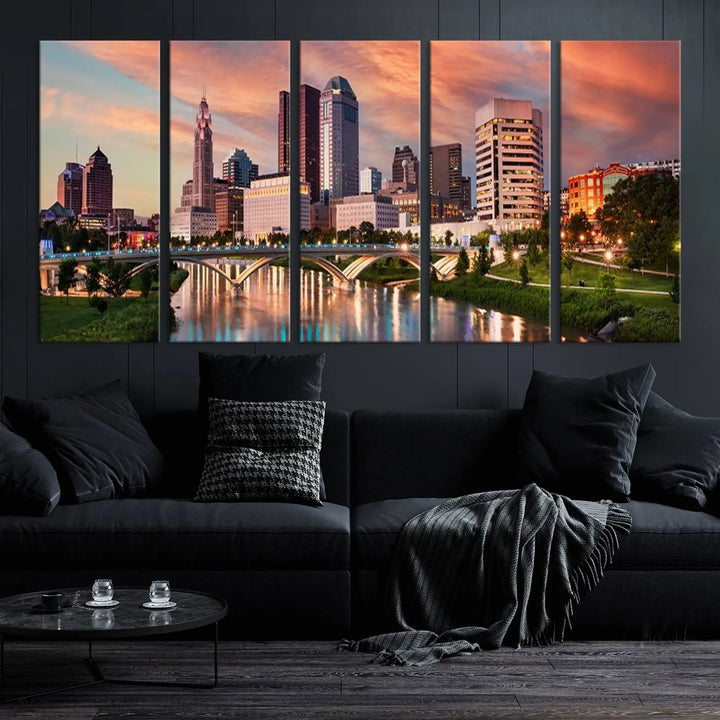 The "Columbus City Lights Sunset Orange Cloudy Skyline Cityscape View Wall Art Canvas Print" showcases a vibrant city skyline at sunset with a bridge spanning a river, strikingly displayed on museum-quality canvas.