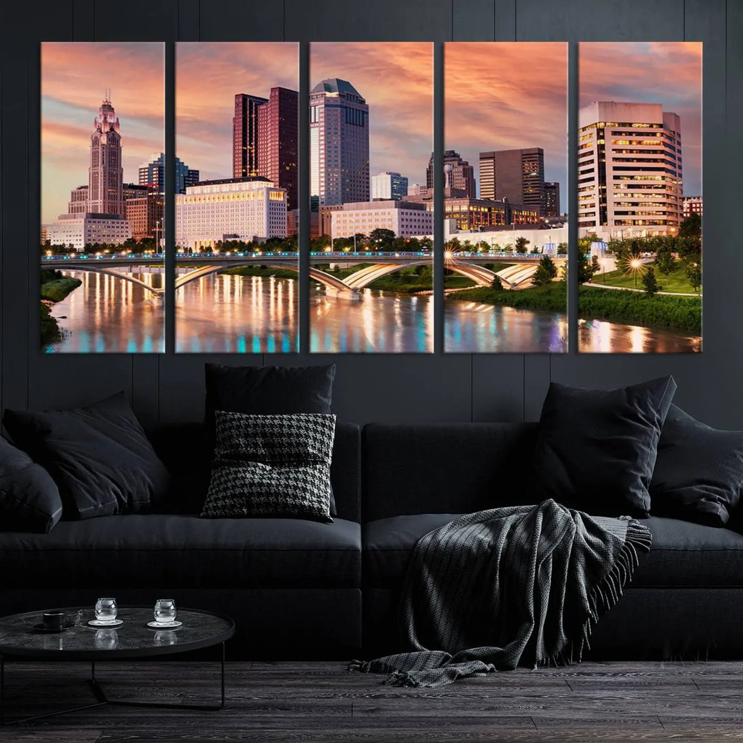 The "Columbus City Lights Sunset Orange Cloudy Skyline Cityscape View" wall art is featured on the wall. This triptych is printed on museum-quality canvas and includes a UV-protective coating, ensuring lasting vibrancy.