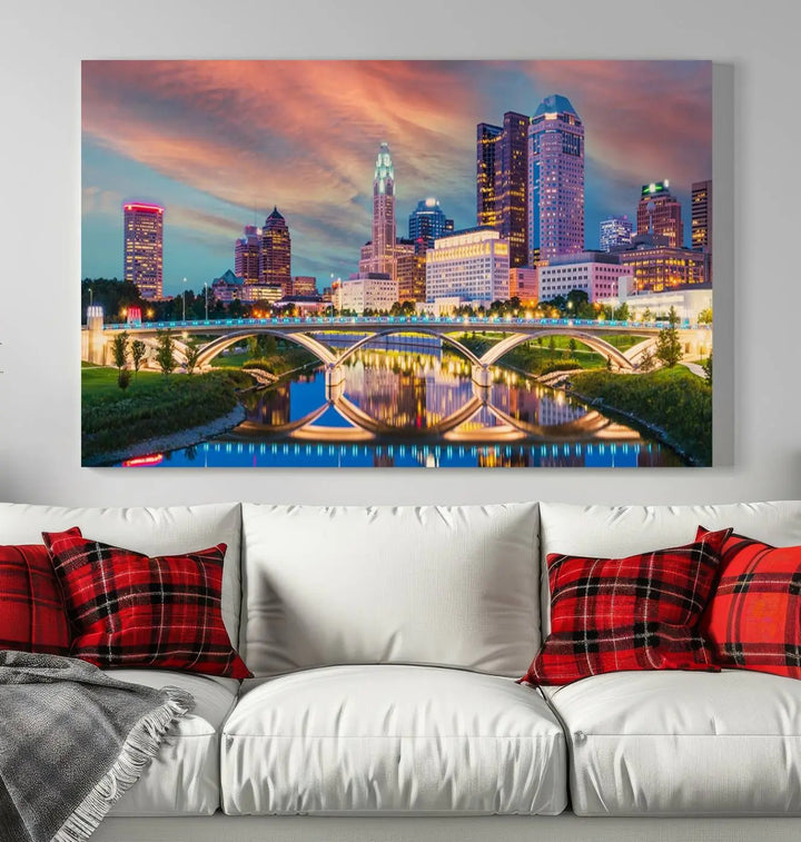 The living room features the Columbus City Lights Sunset Orange Cloudy Skyline Cityscape View Wall Art Canvas Print, designed to be museum-quality and ready to hang under warm lighting.