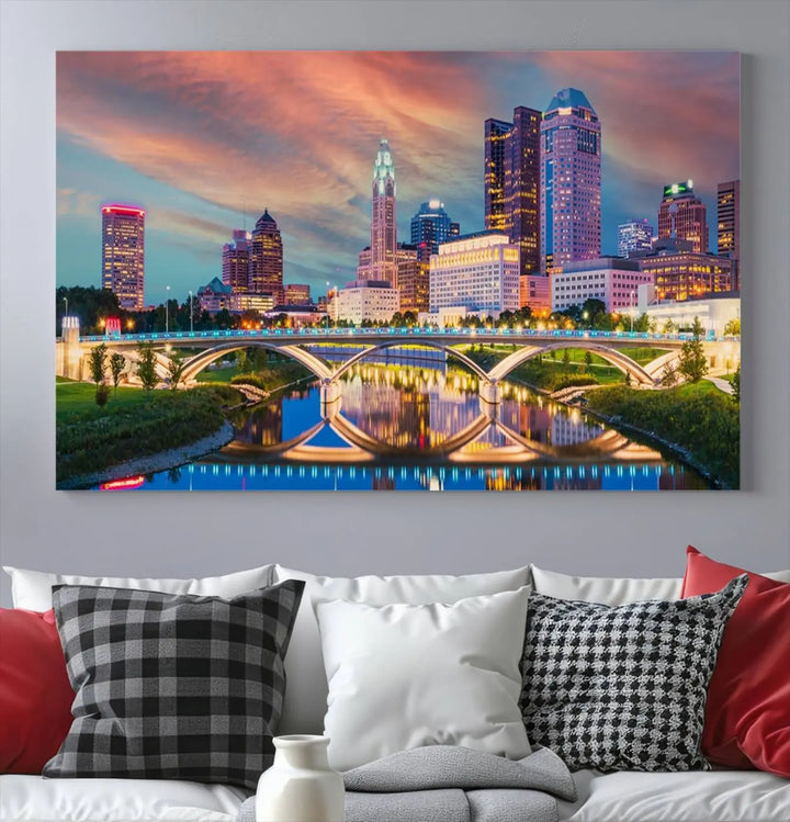 The living room features the Columbus City Lights Sunset Orange Cloudy Skyline Cityscape View Wall Art Canvas Print, designed to be museum-quality and ready to hang under warm lighting.