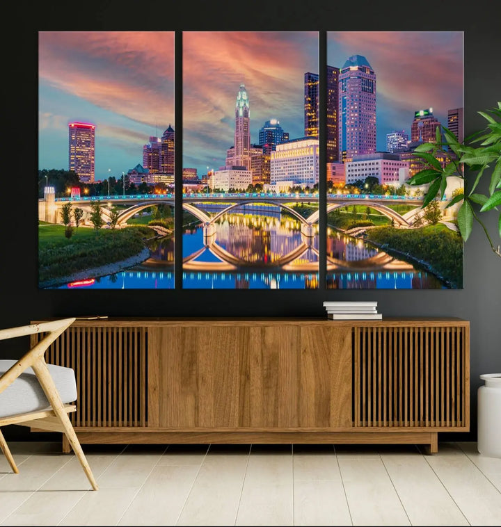 The living room features the Columbus City Lights Sunset Orange Cloudy Skyline Cityscape View Wall Art Canvas Print, designed to be museum-quality and ready to hang under warm lighting.