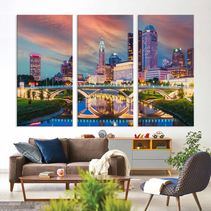 The living room features the Columbus City Lights Sunset Orange Cloudy Skyline Cityscape View Wall Art Canvas Print, designed to be museum-quality and ready to hang under warm lighting.