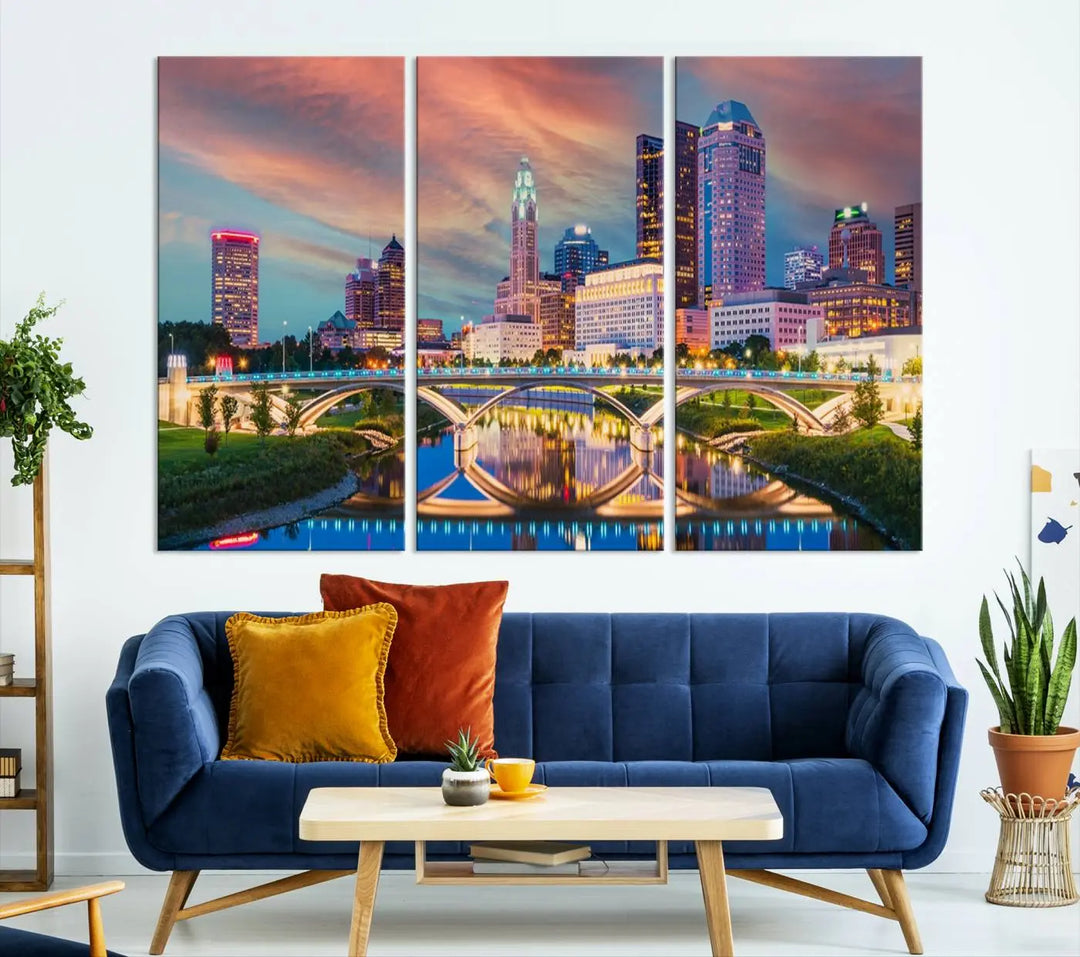 The living room features the Columbus City Lights Sunset Orange Cloudy Skyline Cityscape View Wall Art Canvas Print, designed to be museum-quality and ready to hang under warm lighting.