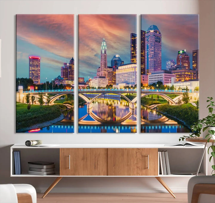 The living room features the Columbus City Lights Sunset Orange Cloudy Skyline Cityscape View Wall Art Canvas Print, designed to be museum-quality and ready to hang under warm lighting.