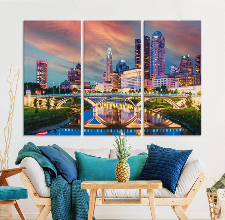 The living room features the Columbus City Lights Sunset Orange Cloudy Skyline Cityscape View Wall Art Canvas Print, designed to be museum-quality and ready to hang under warm lighting.