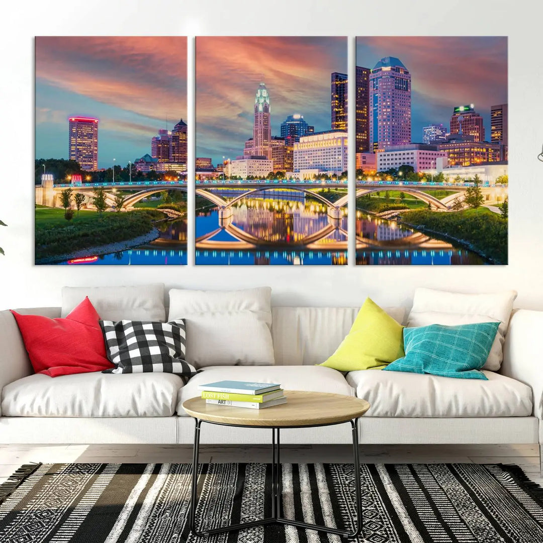 The living room features the Columbus City Lights Sunset Orange Cloudy Skyline Cityscape View Wall Art Canvas Print, designed to be museum-quality and ready to hang under warm lighting.