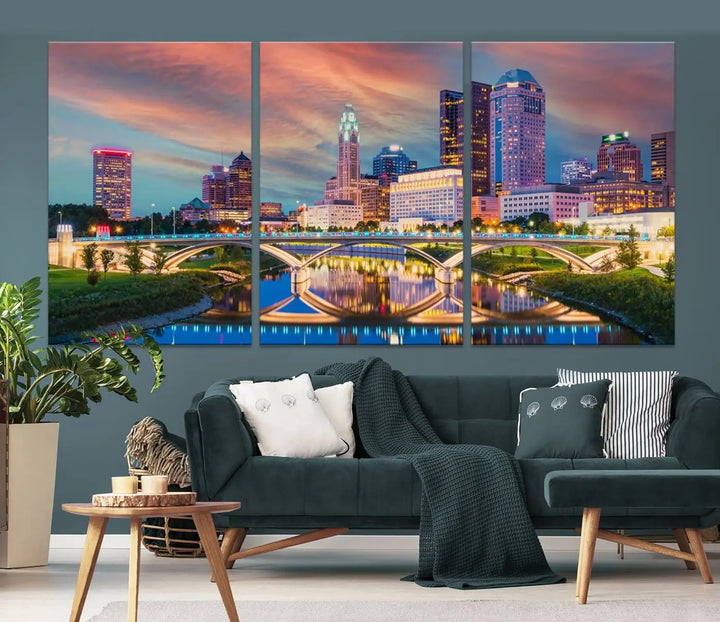 The living room features the Columbus City Lights Sunset Orange Cloudy Skyline Cityscape View Wall Art Canvas Print, designed to be museum-quality and ready to hang under warm lighting.