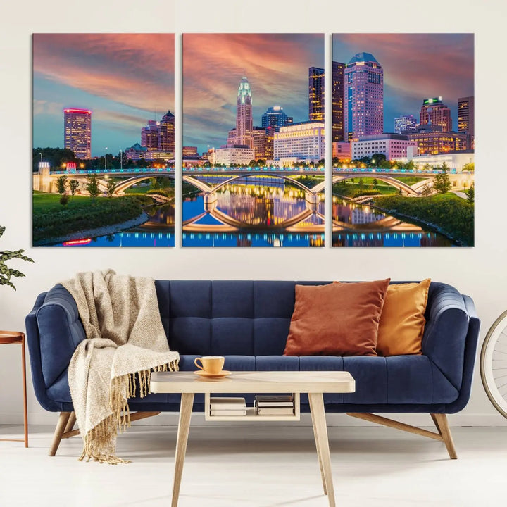 The living room features the Columbus City Lights Sunset Orange Cloudy Skyline Cityscape View Wall Art Canvas Print, designed to be museum-quality and ready to hang under warm lighting.