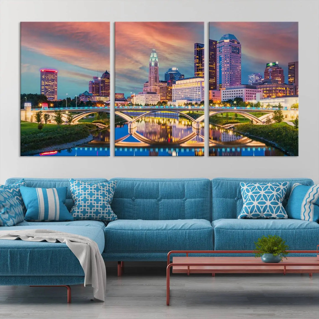 The living room features the Columbus City Lights Sunset Orange Cloudy Skyline Cityscape View Wall Art Canvas Print, designed to be museum-quality and ready to hang under warm lighting.