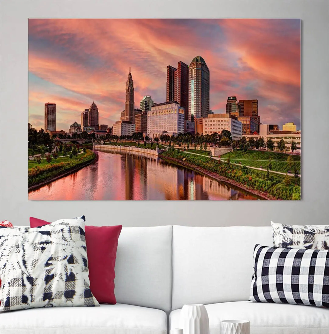 The Columbus City Lights Sunset Orange Cloudy Skyline Cityscape View Wall Art Canvas Print enhances the modern living room. This three-panel piece of the city skyline at sunset is printed on museum-quality canvas, ready to hang, and features a UV-protective coating for lasting brilliance.