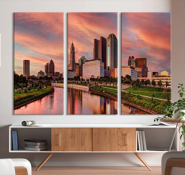 The Columbus City Lights Sunset Orange Cloudy Skyline Cityscape View Wall Art Canvas Print enhances the modern living room. This three-panel piece of the city skyline at sunset is printed on museum-quality canvas, ready to hang, and features a UV-protective coating for lasting brilliance.