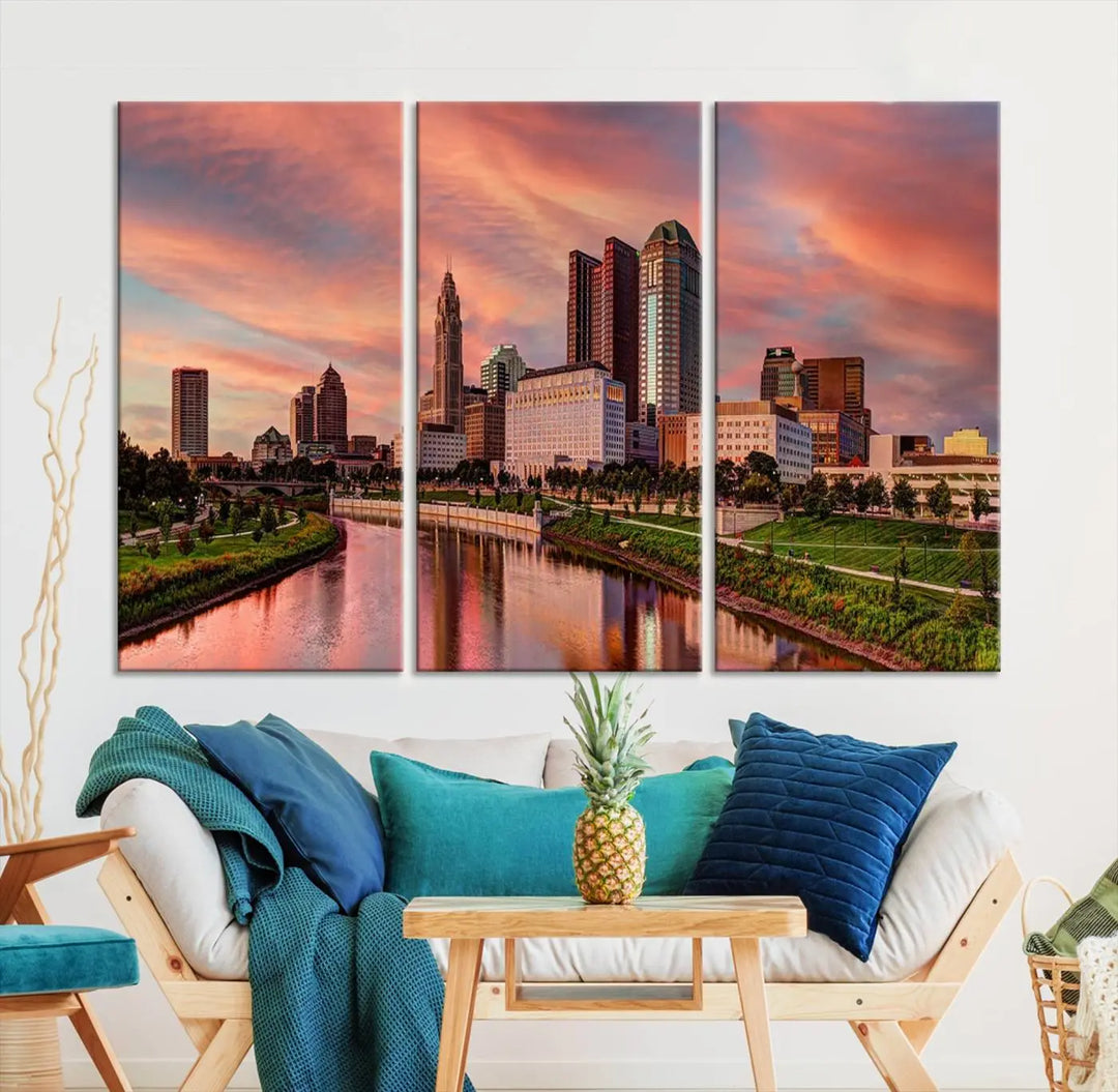 The Columbus City Lights Sunset Orange Cloudy Skyline Cityscape View Wall Art Canvas Print enhances the modern living room. This three-panel piece of the city skyline at sunset is printed on museum-quality canvas, ready to hang, and features a UV-protective coating for lasting brilliance.