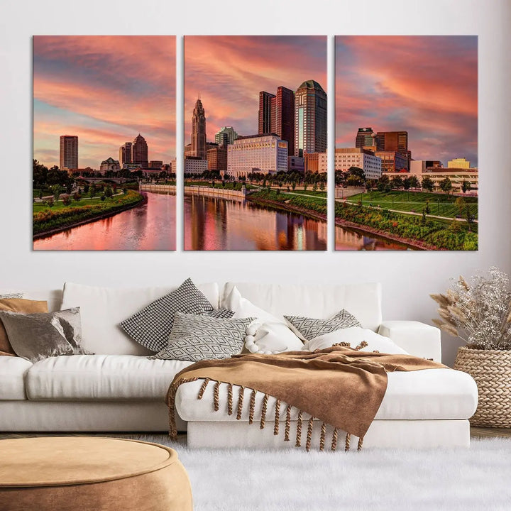 The Columbus City Lights Sunset Orange Cloudy Skyline Cityscape View Wall Art Canvas Print enhances the modern living room. This three-panel piece of the city skyline at sunset is printed on museum-quality canvas, ready to hang, and features a UV-protective coating for lasting brilliance.