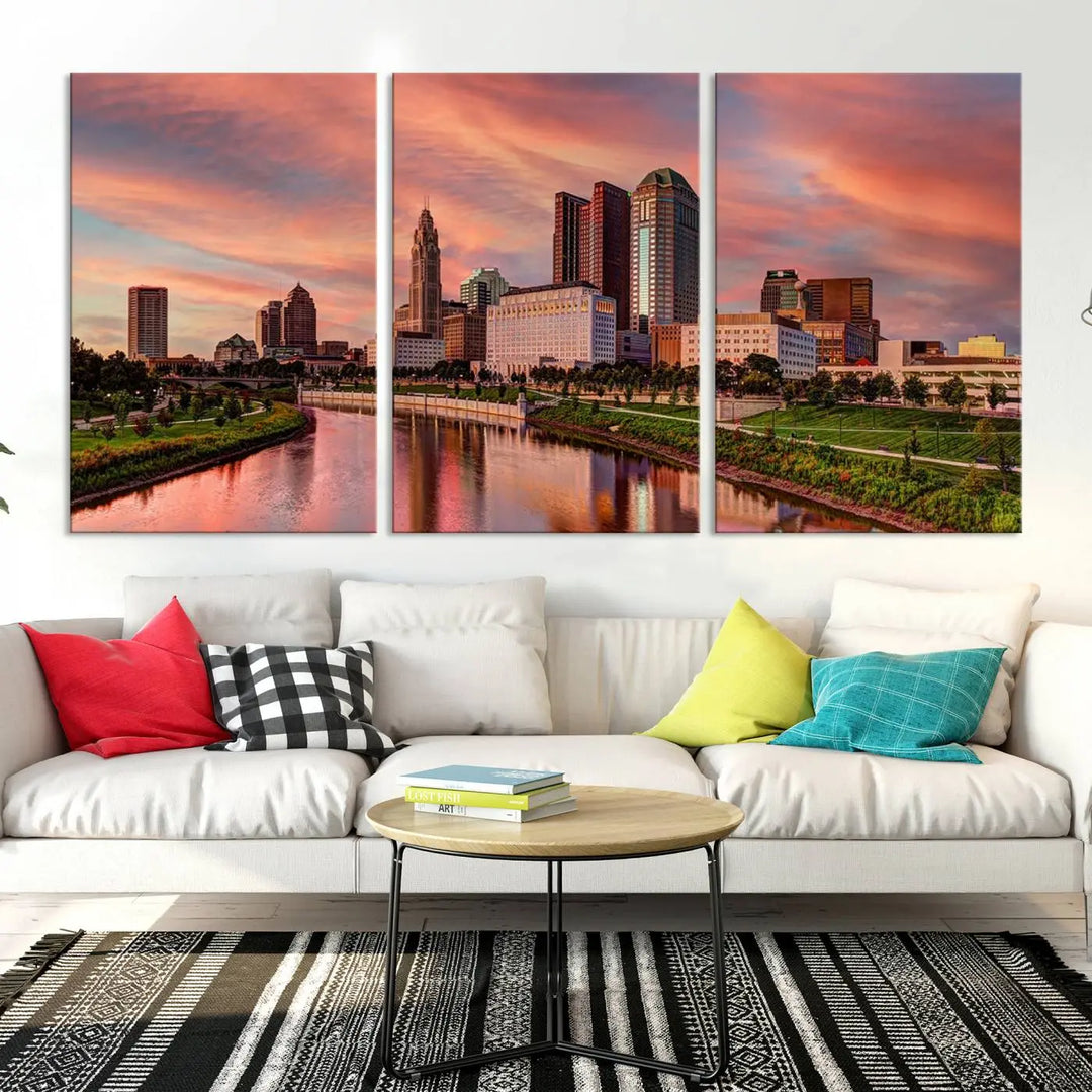 The Columbus City Lights Sunset Orange Cloudy Skyline Cityscape View Wall Art Canvas Print enhances the modern living room. This three-panel piece of the city skyline at sunset is printed on museum-quality canvas, ready to hang, and features a UV-protective coating for lasting brilliance.