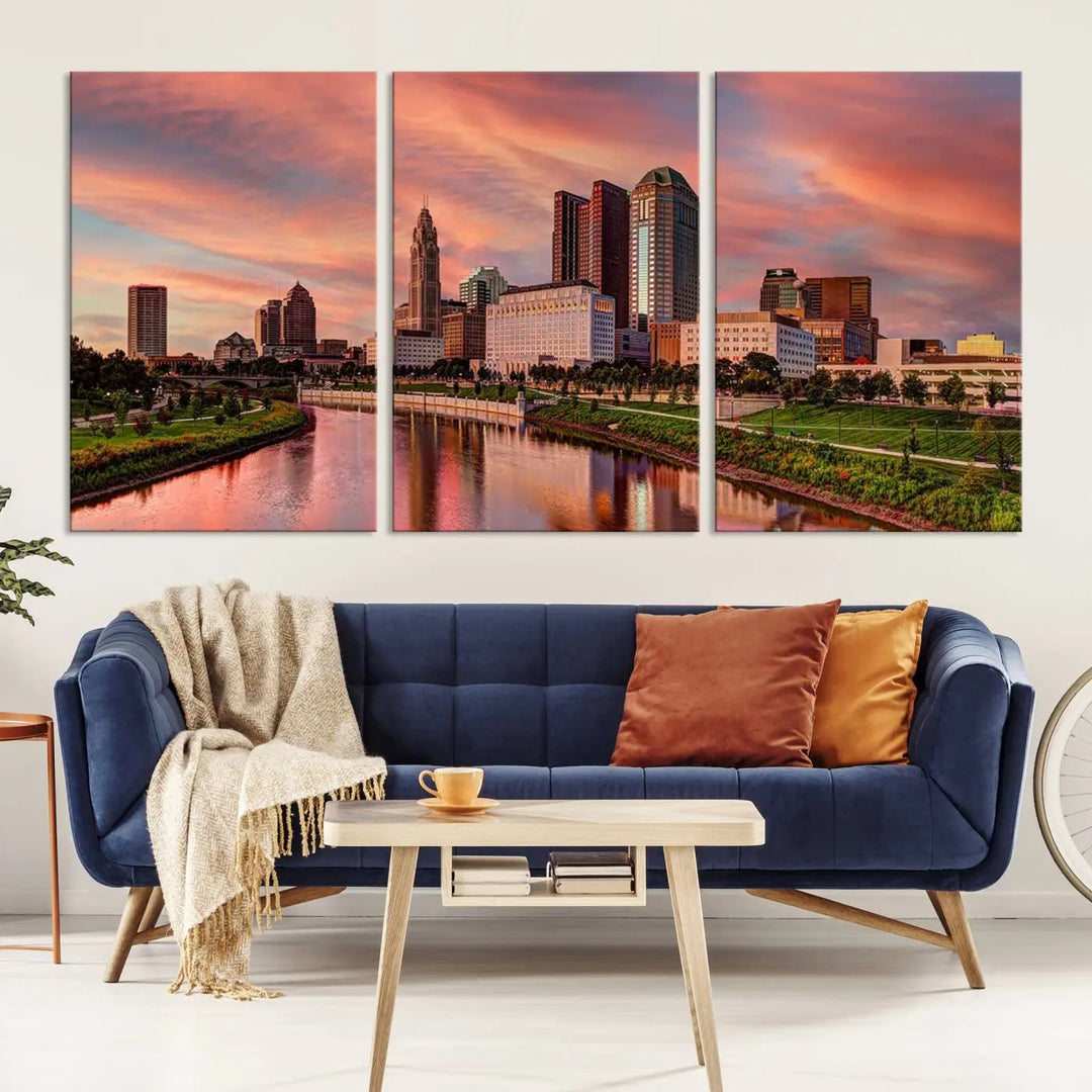 The Columbus City Lights Sunset Orange Cloudy Skyline Cityscape View Wall Art Canvas Print enhances the modern living room. This three-panel piece of the city skyline at sunset is printed on museum-quality canvas, ready to hang, and features a UV-protective coating for lasting brilliance.