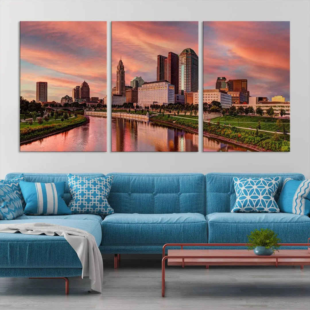 The Columbus City Lights Sunset Orange Cloudy Skyline Cityscape View Wall Art Canvas Print enhances the modern living room. This three-panel piece of the city skyline at sunset is printed on museum-quality canvas, ready to hang, and features a UV-protective coating for lasting brilliance.