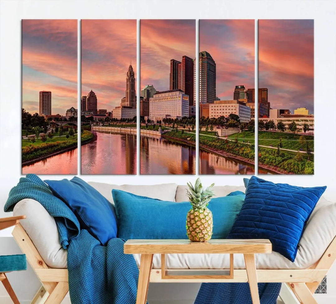 The Columbus City Lights Sunset Orange Cloudy Skyline Cityscape View Wall Art Canvas Print enhances the modern living room. This three-panel piece of the city skyline at sunset is printed on museum-quality canvas, ready to hang, and features a UV-protective coating for lasting brilliance.