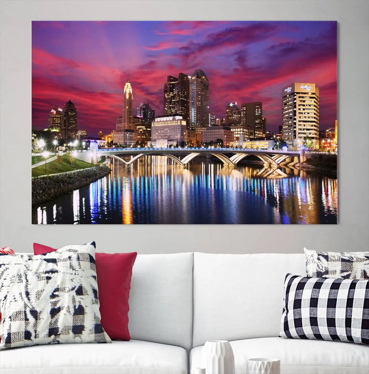 The "Columbus City Lights Sunset Pink and Purple Cloudy Skyline Cityscape View Wall Art Canvas Print" captures the beauty of a city skyline at dusk with its reflection on the river. Crafted on museum-quality canvas with a UV-protective coating, this triptych wall art is ready to hang and adds an elegant touch to any room.