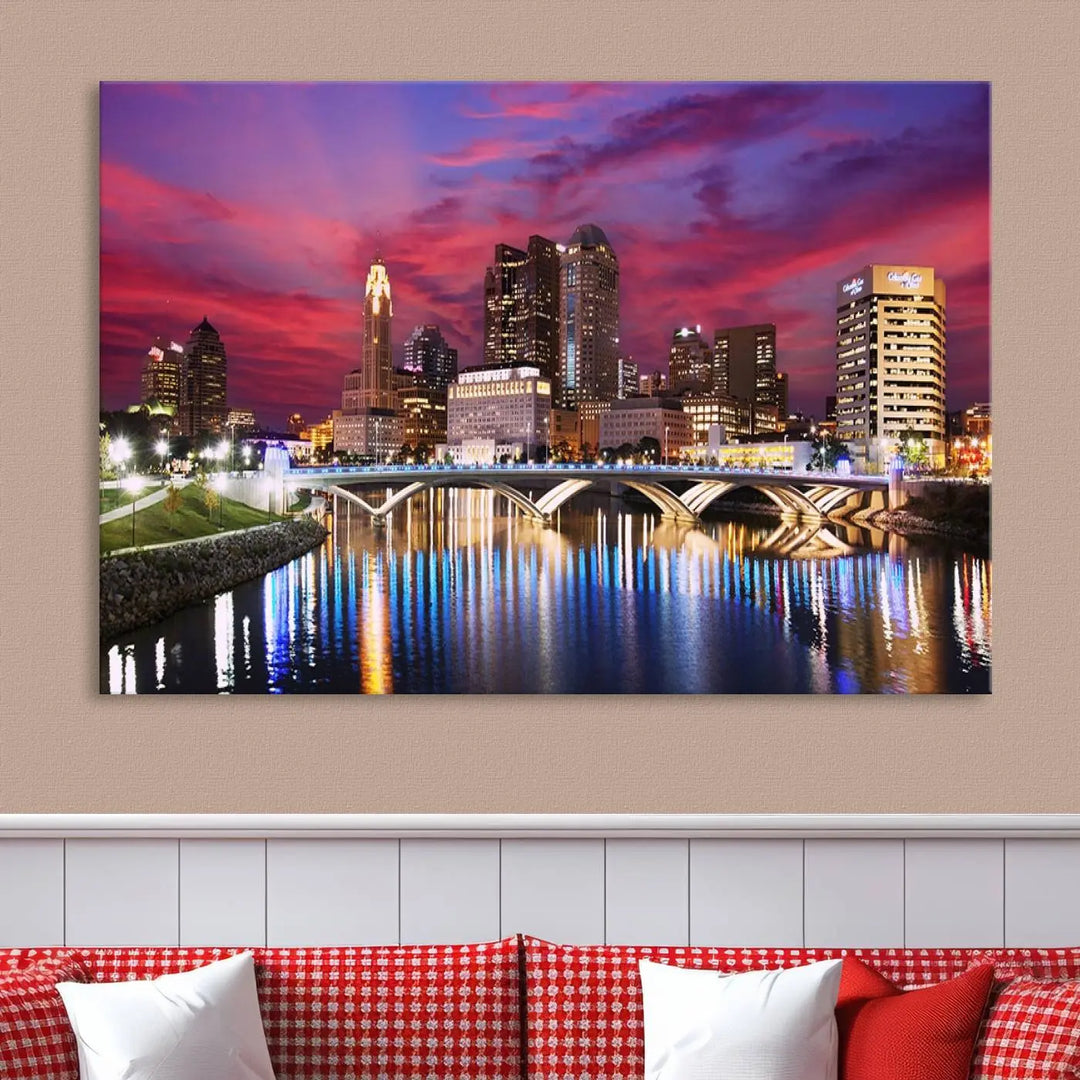 The "Columbus City Lights Sunset Pink and Purple Cloudy Skyline Cityscape View Wall Art Canvas Print" captures the beauty of a city skyline at dusk with its reflection on the river. Crafted on museum-quality canvas with a UV-protective coating, this triptych wall art is ready to hang and adds an elegant touch to any room.