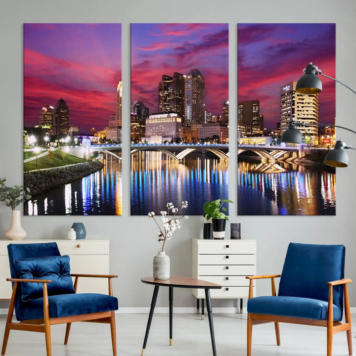 The "Columbus City Lights Sunset Pink and Purple Cloudy Skyline Cityscape View Wall Art Canvas Print" captures the beauty of a city skyline at dusk with its reflection on the river. Crafted on museum-quality canvas with a UV-protective coating, this triptych wall art is ready to hang and adds an elegant touch to any room.