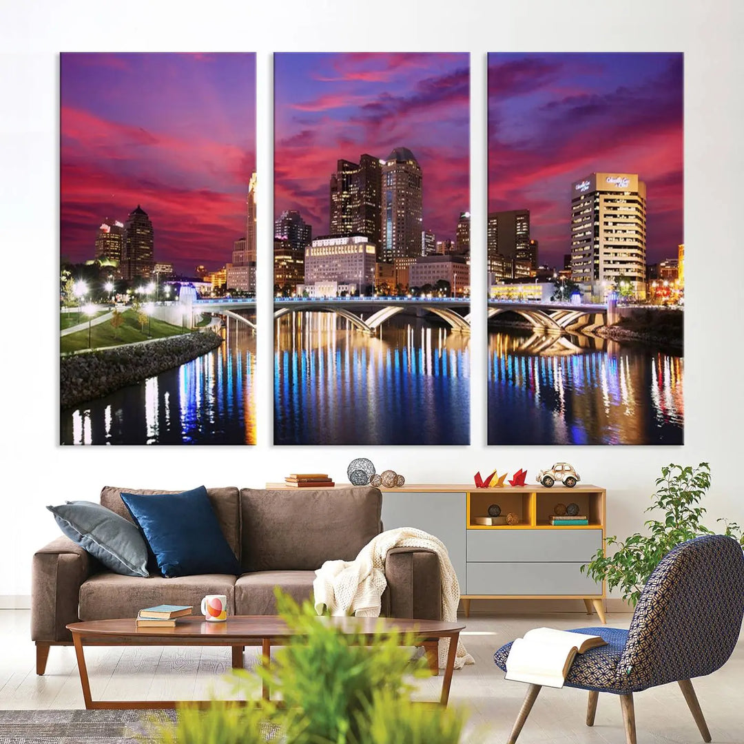 The "Columbus City Lights Sunset Pink and Purple Cloudy Skyline Cityscape View Wall Art Canvas Print" captures the beauty of a city skyline at dusk with its reflection on the river. Crafted on museum-quality canvas with a UV-protective coating, this triptych wall art is ready to hang and adds an elegant touch to any room.