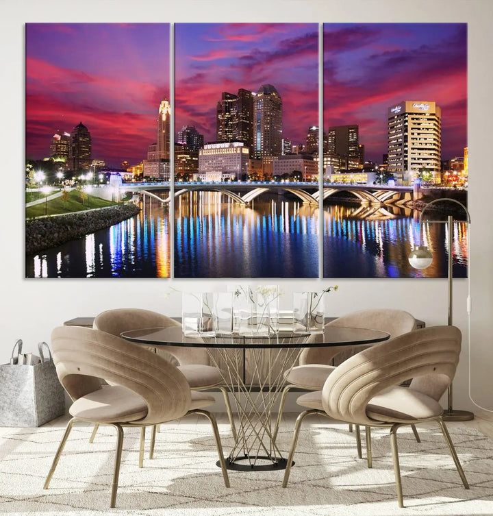 The "Columbus City Lights Sunset Pink and Purple Cloudy Skyline Cityscape View Wall Art Canvas Print" captures the beauty of a city skyline at dusk with its reflection on the river. Crafted on museum-quality canvas with a UV-protective coating, this triptych wall art is ready to hang and adds an elegant touch to any room.