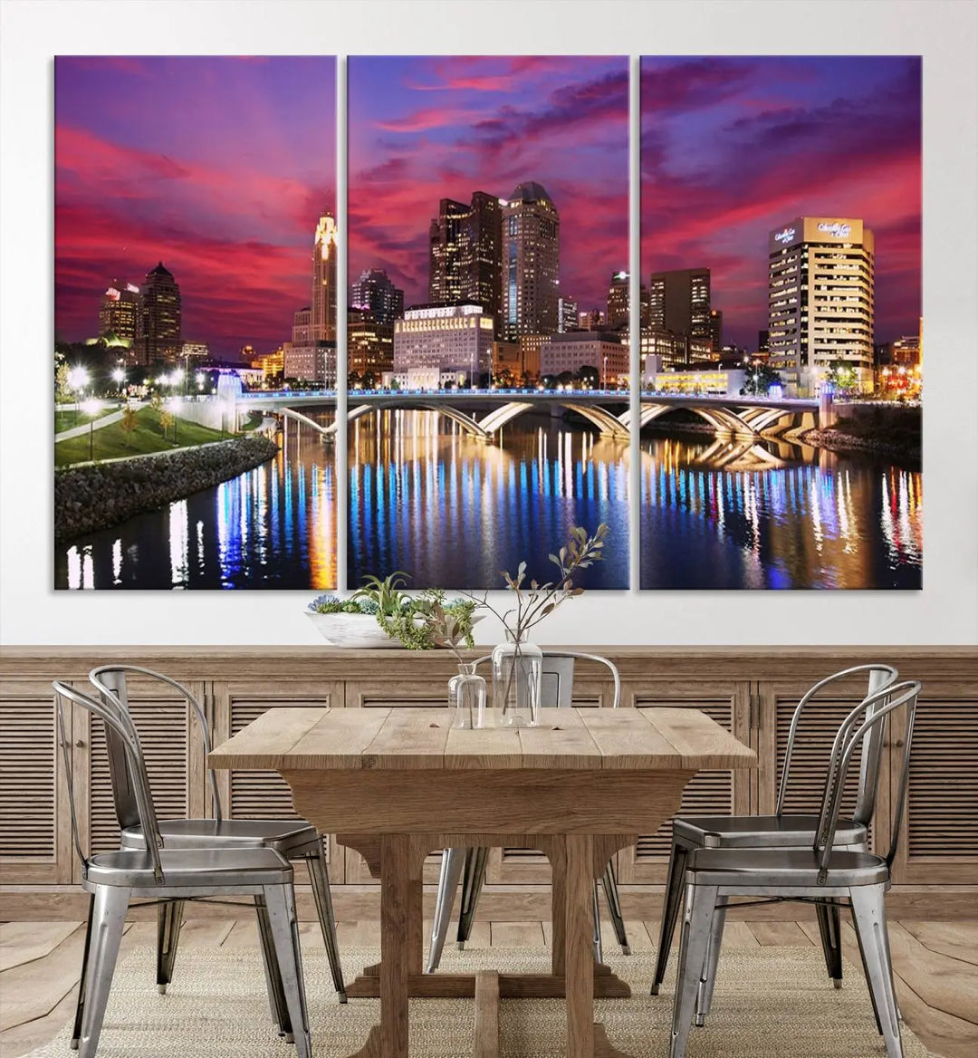 The "Columbus City Lights Sunset Pink and Purple Cloudy Skyline Cityscape View Wall Art Canvas Print" captures the beauty of a city skyline at dusk with its reflection on the river. Crafted on museum-quality canvas with a UV-protective coating, this triptych wall art is ready to hang and adds an elegant touch to any room.