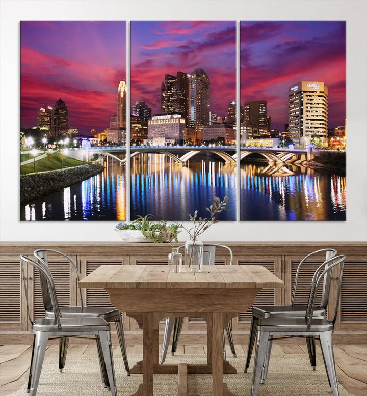 The "Columbus City Lights Sunset Pink and Purple Cloudy Skyline Cityscape View Wall Art Canvas Print" captures the beauty of a city skyline at dusk with its reflection on the river. Crafted on museum-quality canvas with a UV-protective coating, this triptych wall art is ready to hang and adds an elegant touch to any room.