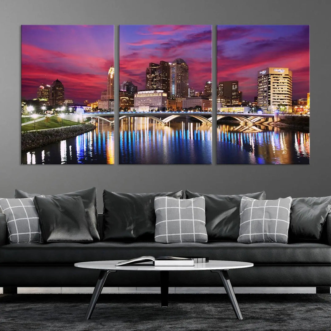 The "Columbus City Lights Sunset Pink and Purple Cloudy Skyline Cityscape View Wall Art Canvas Print" captures the beauty of a city skyline at dusk with its reflection on the river. Crafted on museum-quality canvas with a UV-protective coating, this triptych wall art is ready to hang and adds an elegant touch to any room.