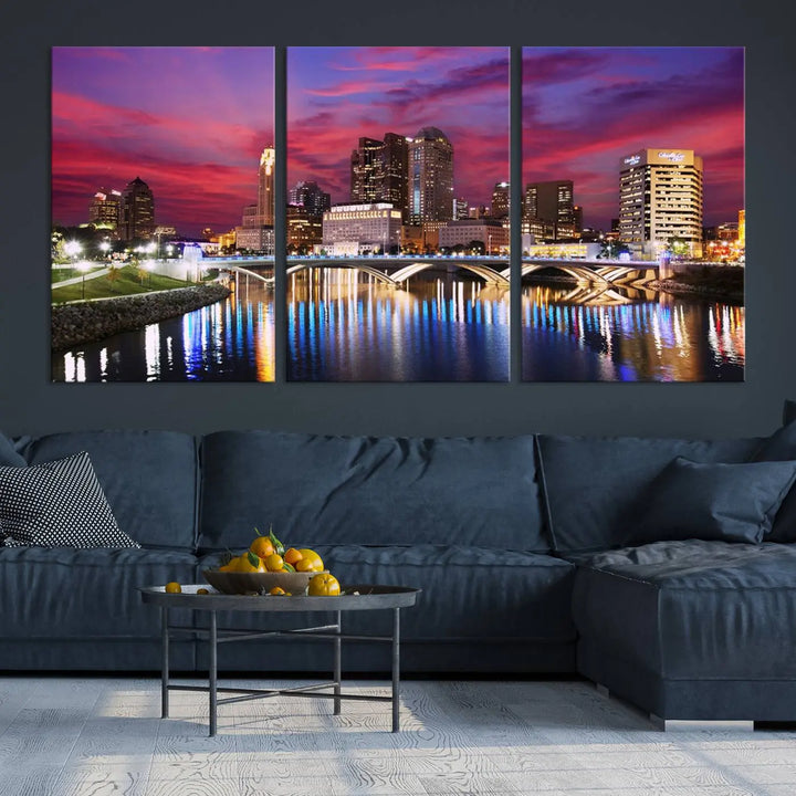 The "Columbus City Lights Sunset Pink and Purple Cloudy Skyline Cityscape View Wall Art Canvas Print" captures the beauty of a city skyline at dusk with its reflection on the river. Crafted on museum-quality canvas with a UV-protective coating, this triptych wall art is ready to hang and adds an elegant touch to any room.