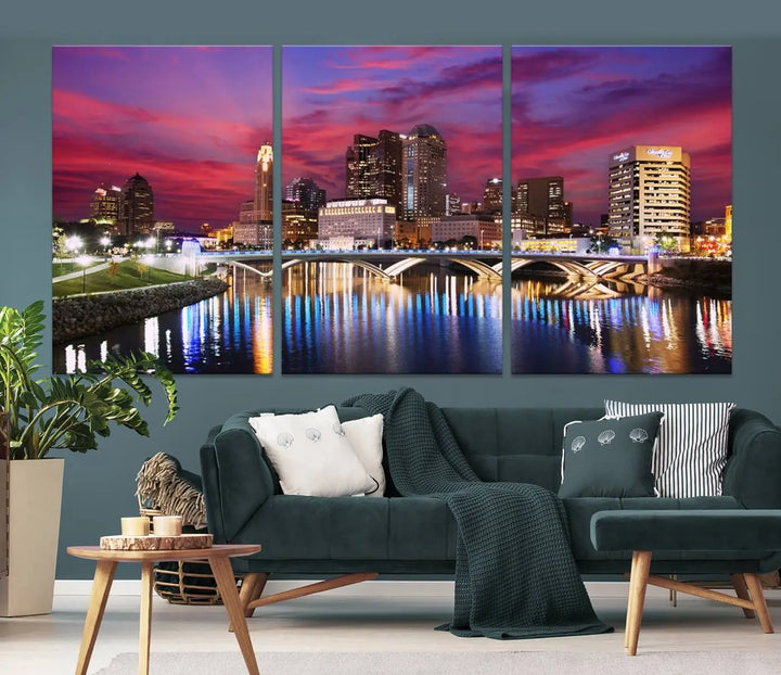 The "Columbus City Lights Sunset Pink and Purple Cloudy Skyline Cityscape View Wall Art Canvas Print" captures the beauty of a city skyline at dusk with its reflection on the river. Crafted on museum-quality canvas with a UV-protective coating, this triptych wall art is ready to hang and adds an elegant touch to any room.