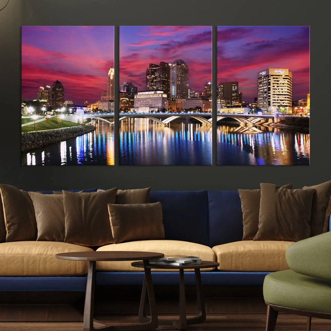 The "Columbus City Lights Sunset Pink and Purple Cloudy Skyline Cityscape View Wall Art Canvas Print" captures the beauty of a city skyline at dusk with its reflection on the river. Crafted on museum-quality canvas with a UV-protective coating, this triptych wall art is ready to hang and adds an elegant touch to any room.