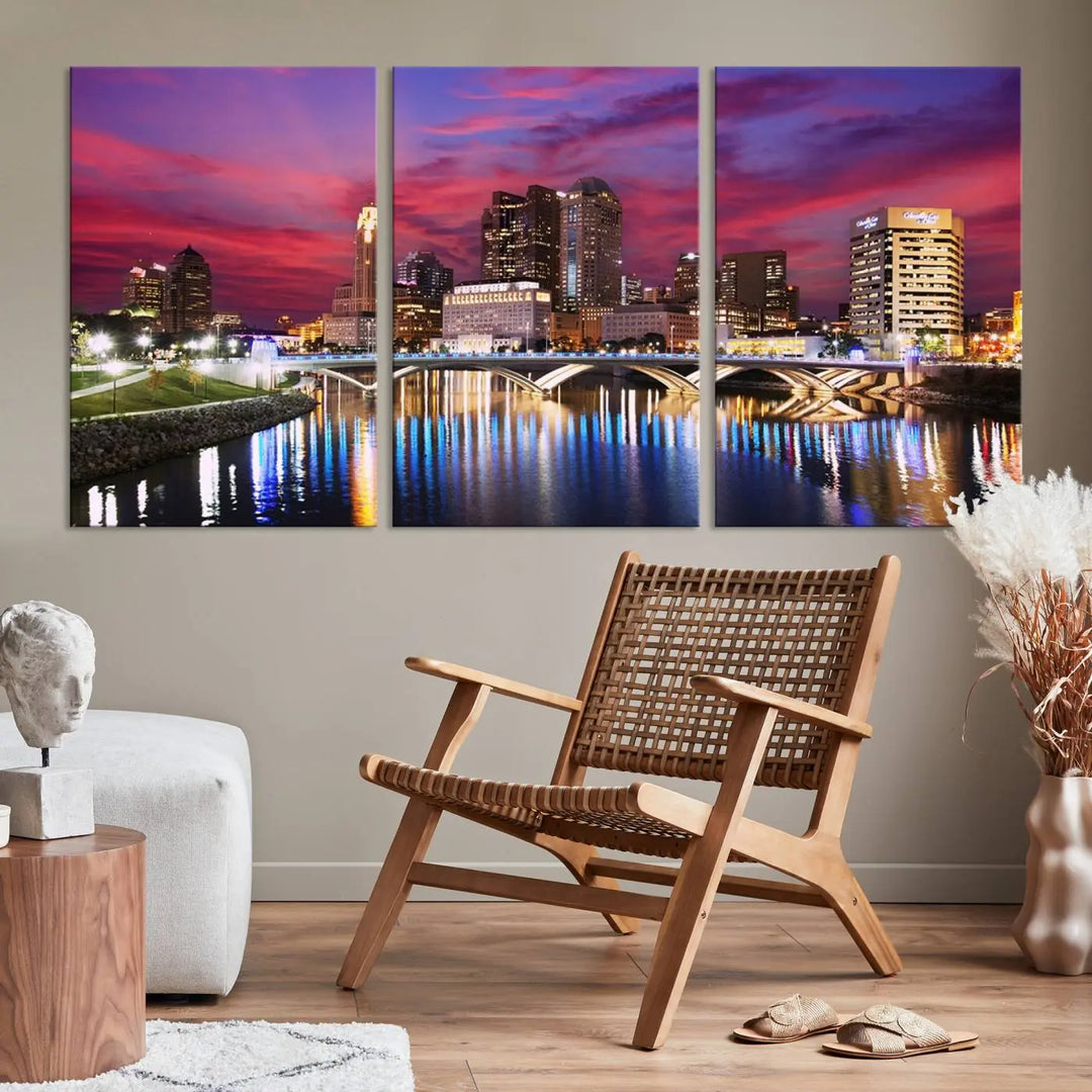 The "Columbus City Lights Sunset Pink and Purple Cloudy Skyline Cityscape View Wall Art Canvas Print" captures the beauty of a city skyline at dusk with its reflection on the river. Crafted on museum-quality canvas with a UV-protective coating, this triptych wall art is ready to hang and adds an elegant touch to any room.